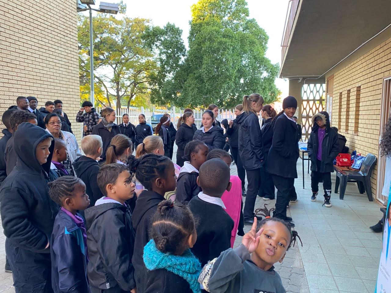 IA Academy full school gathering for the Smile Haven dental hygiene visit, July 2026