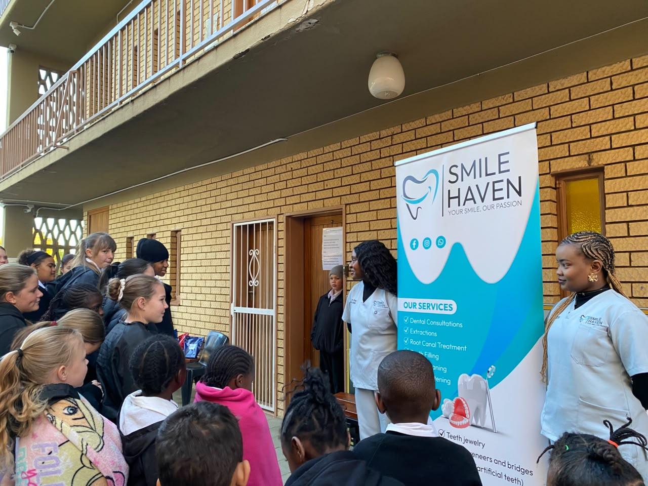 Smile Haven team presenting dental hygiene tips to IA Academy learners, July 2026